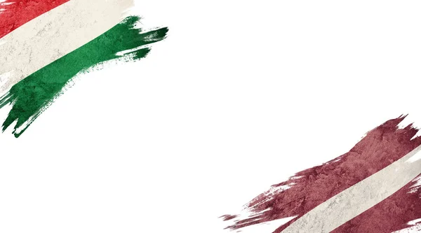 白色背景下的匈牙利和拉脱维亚国旗 — 图库照片